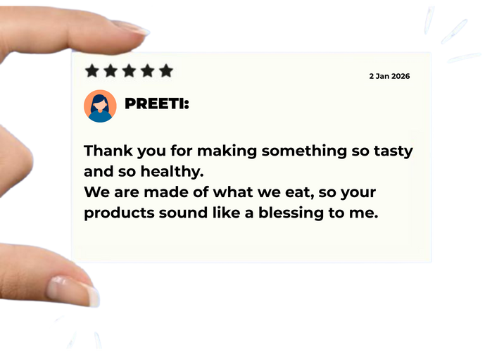 Five-star review card with a message of gratitude for a healthy product, held by a hand.