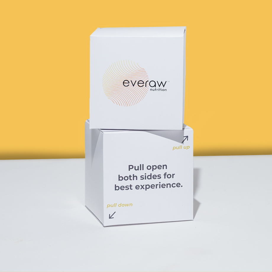 Two boxes of Everaw Nutrition on a white surface with a yellow background