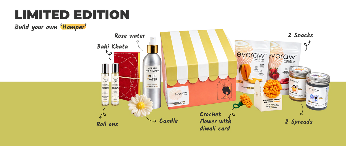 Limited edition Everaw Diwali hamper, build your own: a striped gift box with mood roll ons, a bahi khata, rose water, a flower candle, a crochet flower with a Diwali card, two fruit snacks and two Super Spreads