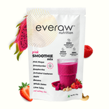 Everaw Pink Smoothie Mix 43g sachet beside a glass of pink dragon fruit smoothie with fresh pink pitaya, strawberries, raspberries and cashews, zero refined sugar, zero additives and zero preservatives